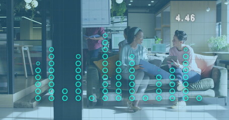 Image of financial data processing over diverse business people discussing work at office