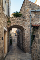 Romantic narrow stone alley in the center of the old town of Budva, Montenegro
