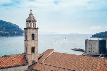 Amazing panoramic view of picturesque Dubrovnik old town, towers, narrow stone streets and buildings with red roofs on Adriatic sea coast, Croatia. - 757870840