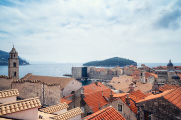 Amazing panoramic view of picturesque Dubrovnik old town, towers, narrow stone streets and buildings with red roofs on Adriatic sea coast, Croatia. - 757871010