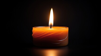 Obraz na płótnie Canvas Burning candle with light rays againsts a black background.