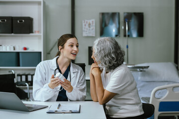 Medicine, healthcare and people concept, Pharmacists or doctors giving explanation about medicine to patient in clinic.