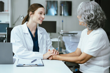 Doctor's hand reassuring patient and recommending treatment methods at the clinic.