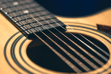 Fototapeta premium Close up of guitar and strings with shallow depth of field, soft focus.