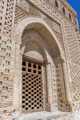 Detailed facade of the Samanid Mausoleum showcases the splendor of Persian ancient architecture. Mug-bricks, geometrical ornaments. Bukhara (Buxoro), Uzbekistan