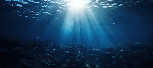 Dark blue ocean surface seen from underwater. sun light rays under water