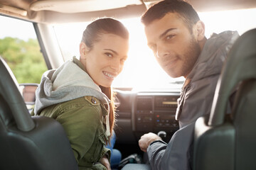 Couple, smile and portrait in car for road trip, travel or journey in vehicle and outdoor for holiday. Man, woman and happy in seat with radio and jacket for driver, passenger and safety together