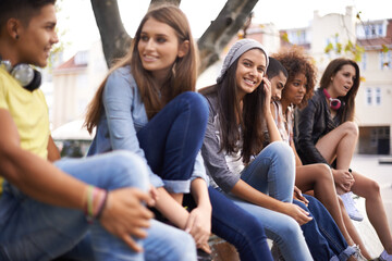 Happy, portrait and girl with students in city for bonding, talking and sitting together. Smile,...