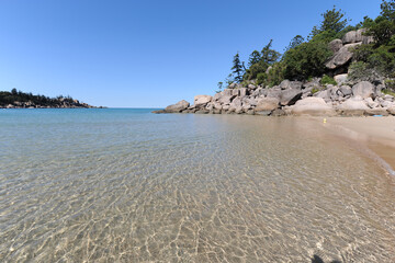 Idyllic empty tropical beach scene with crystal clear water at Florence Bay, Magnetic Island, Queensland, Australia