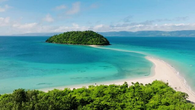 Tropical Island with sandbar and white beach with turquoise sea water. Bon Bon Beach. Romblon, Philippines.