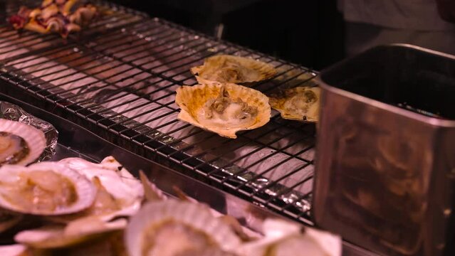 Scallops Grilling Over Charcoal Fire