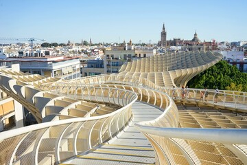 Fototapeta premium Seville cityscape as seen from metropol parasol building.people walking around and enjoying the view.