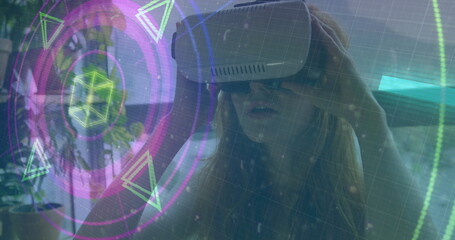Image of scope scanning and data processing over woman wearing vr headset