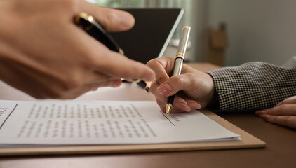 Lawyer and businesswomen discussing and introducing Providing legal advice regarding signing insurance contracts or financial contracts