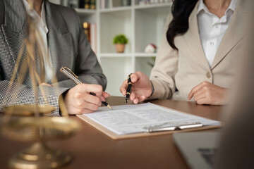 Lawyer and businesswomen discussing and introducing Providing legal advice regarding signing insurance contracts or financial contracts