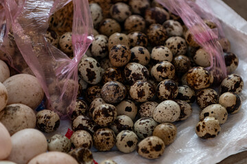 Fresh Quail and Chicken eggs at an open air market in Vietnam.
