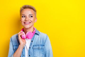 Photo portrait of attractive young woman headphones look empty space dressed stylish denim clothes...