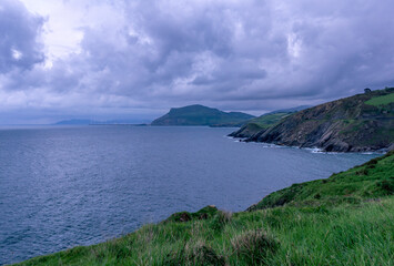 view of the sea and mountains on a cloudy day