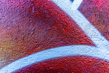 Colorful beautiful background of urban spray drawing graffiti on city wall. Bright vivid pattern of  modern art for wallpaper and design.