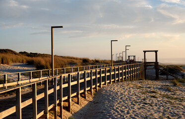 wooden promenade path above the dunes on the beach of Torreira district of Aveiro, Portugal