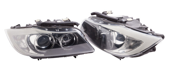 Stylish xenon headlight of a German car - optical equipment with a lamp inside on a white isolated background. Spare part for auto repair in a car workshop.