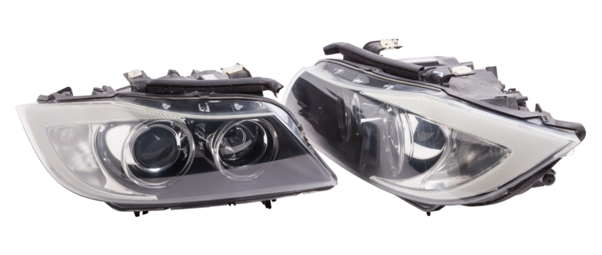 Stylish xenon headlight of a German car - optical equipment with a lamp inside on a white isolated background. Spare part for auto repair in a car workshop.