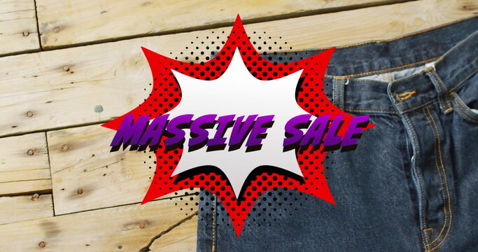 Image of retro massive sale text over denim trousers background - Powered by Adobe