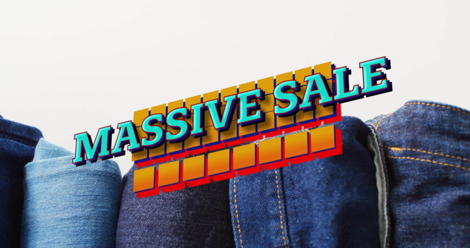 Image of massive sale text over denim trousers background - Powered by Adobe