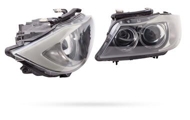 Stylish xenon headlight of a German car - optical equipment with a lamp inside on a white isolated background. Spare part for auto repair in a car workshop. © Aleksandr Kondratov