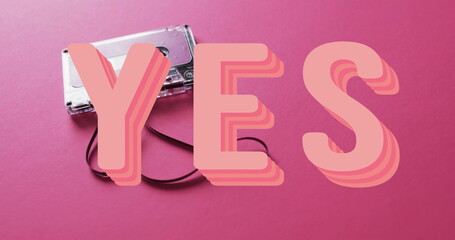 Image of yes text over tape on pink background