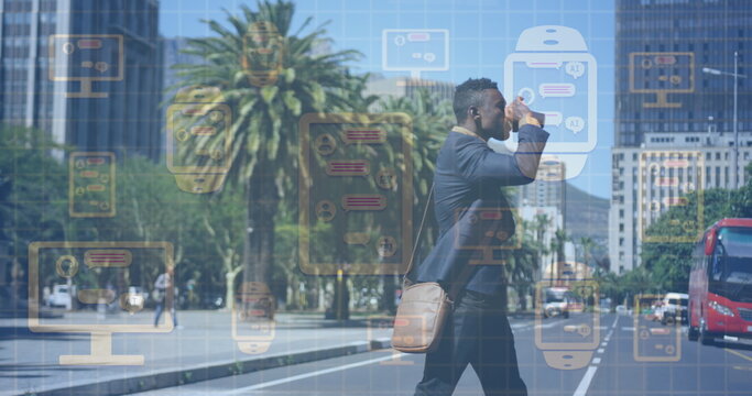 Image of online chat and data processing on electronic devices over african american businessman