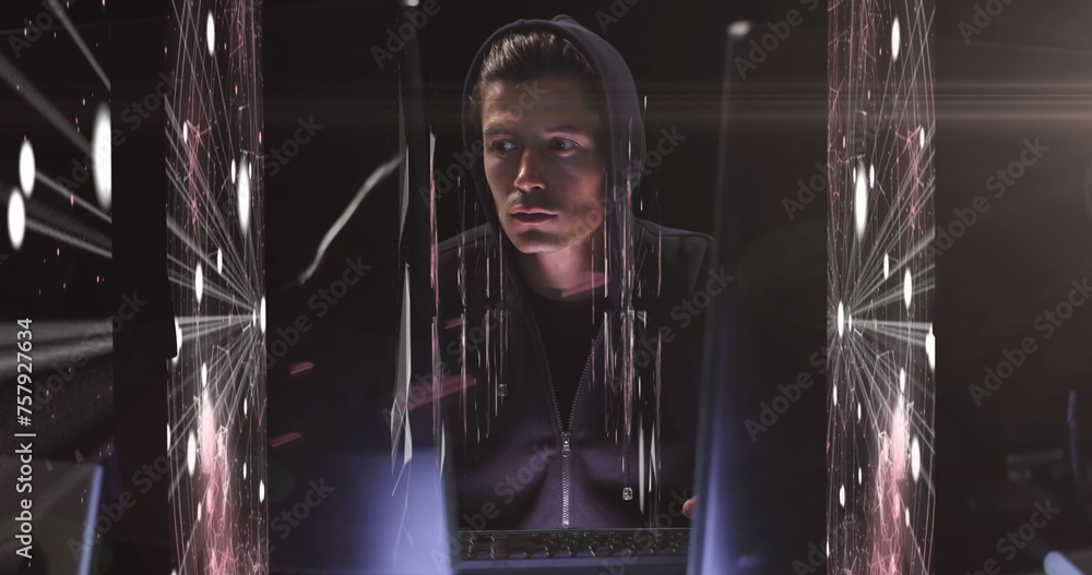 Poster hooded hacker manipulates digital connections on multiple screens.