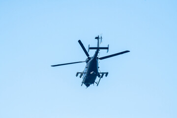 helicopter flying on isolated blue sky