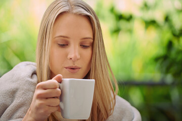 Garden, relax and woman with coffee in morning with drink, caffeine beverage and cappuccino for aroma. Happy, calm and person with mug in nature or backyard for breakfast, peaceful and wellness