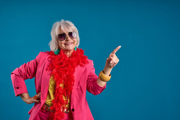 Senior fashion woman exuding confidence and pointing to an offer