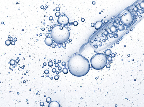 Pipette with blue niacinamide serum oil sample swatch texture with bubbles. Cosmetic Hyaluronic acid retinol science lab product