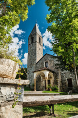 Fototapeta na wymiar old historic stone church in a small village of the french Alps.