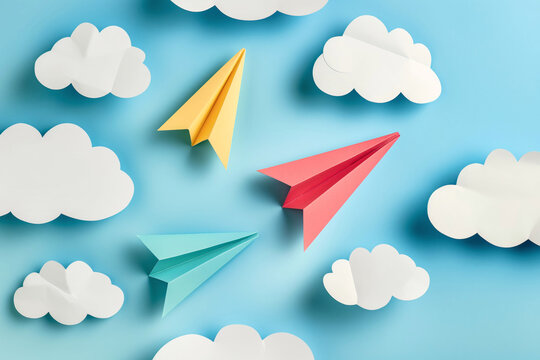 Colorful Origami Paper Planes Among Clouds on Blue Sky - Playful Art Concept

