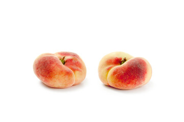 Two saturn peaches or flat peaches isolated on white background with clipping path..