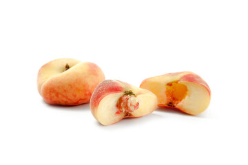 Whole and half of saturn peach or flat peaches isolated on white background with clipping path..