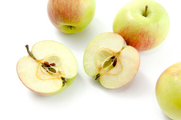 Half and whole of green apples isolated on white background with clipping path..