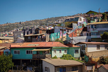 Valparaiso cityscape, colorful houses in Valparaiso, Chile. Old house with a spire against blue sky