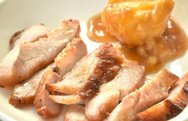 grilled pork neck with mashed potato dressing gravy on plate dipping spicy sauce 