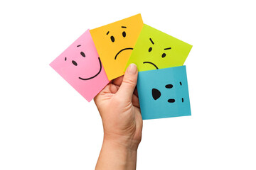 Hand holds notes with a basic emotions - joy, sadness, anger, fear or surprise. Four colorful...