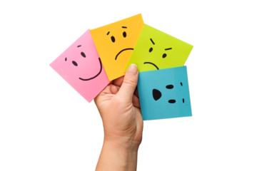 Hand holds notes with a basic emotions - joy, sadness, anger, fear or surprise. Four colorful squares with emotions on a transparent background