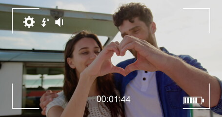Young couple captured on a digital camera screen in 4k record mode.
