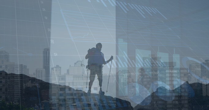 Image of financial data processing over caucasian male hiker and cityscape - Powered by Adobe