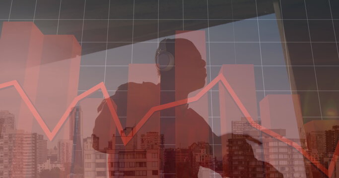 Image of financial graphs and data over cityscape and hiker - Powered by Adobe