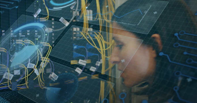 Image of interface with data processing over biracial female engineer working at server room