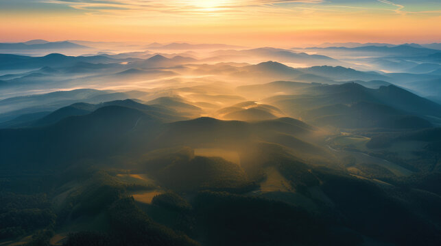 landscape of mountains with fog, forests and fields, clouds in the sky with a ray of sunshine, dawn, panorama, view from the top